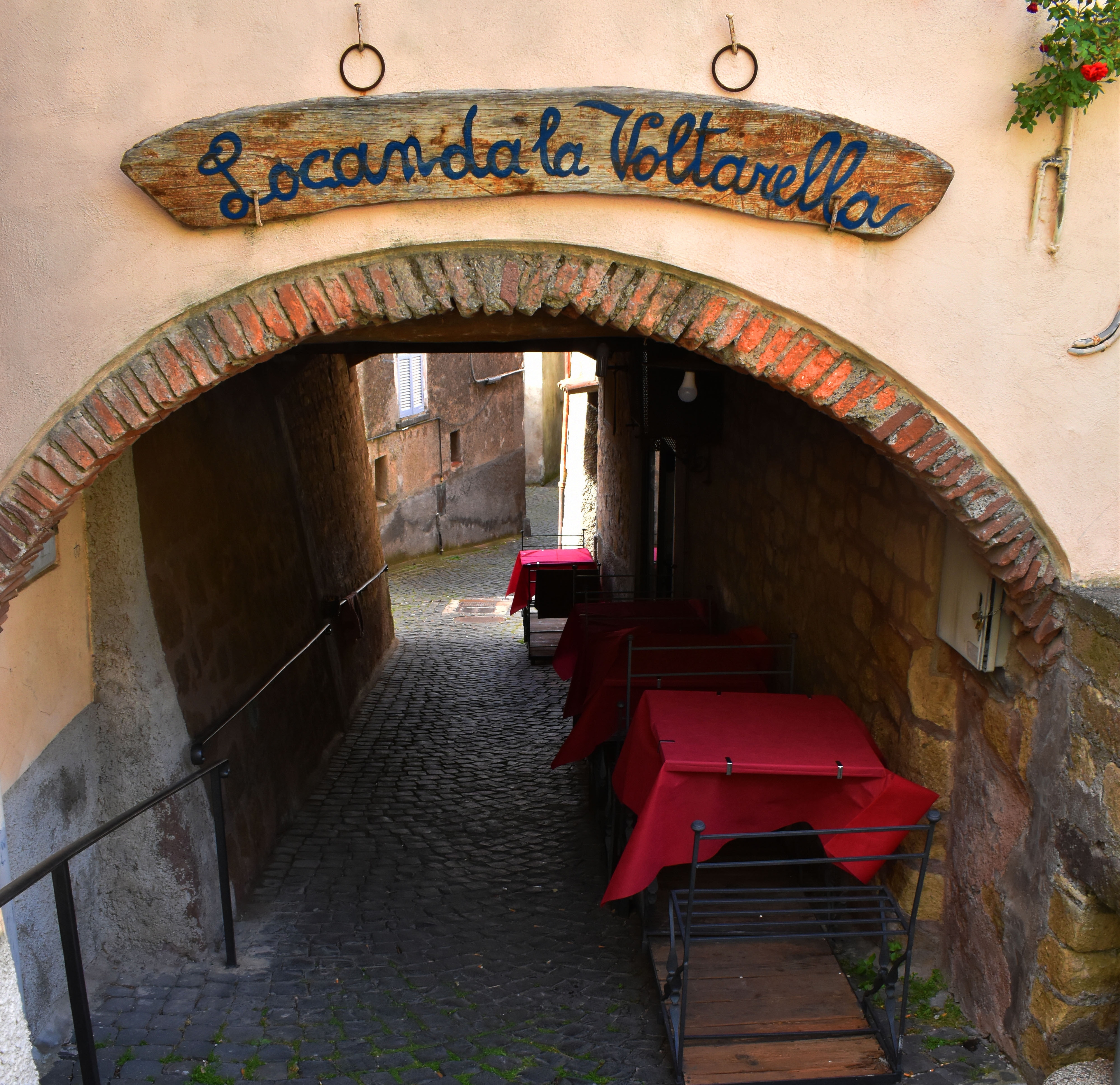 header image with table and chairs of Voltarella restaurant